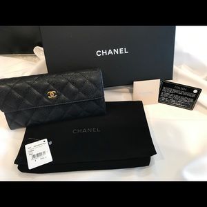 Authentic Chanel caviar wallet in black.